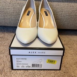 White patent pumps